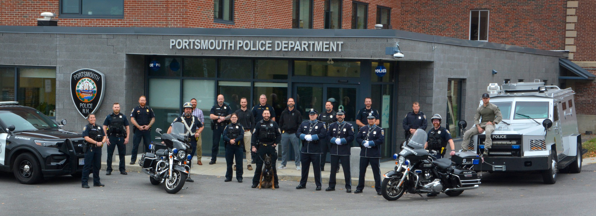 Police officers in front of current Police Department Facility