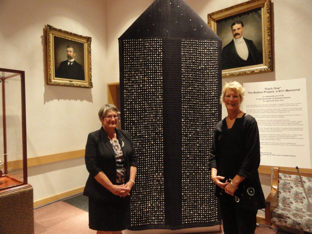 Artist Sarah Haskell and Councilor Chris Dwyer with the 911 artwork in Council Chambers.