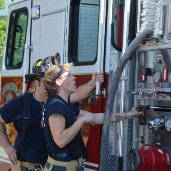 Fire Fighters Maintaining Fire Truck