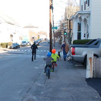 Kids riding bicycles on Islington Street