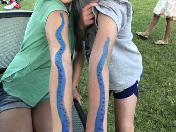 Two tweens show off matching facepaint