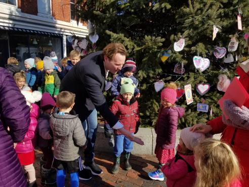 Mayor McEachern with children from The Treehouse School and Tree of Love